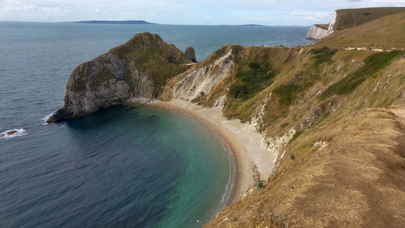 Man O'War Cove from the clifftop path, with the headland that separates it from Durdle Door