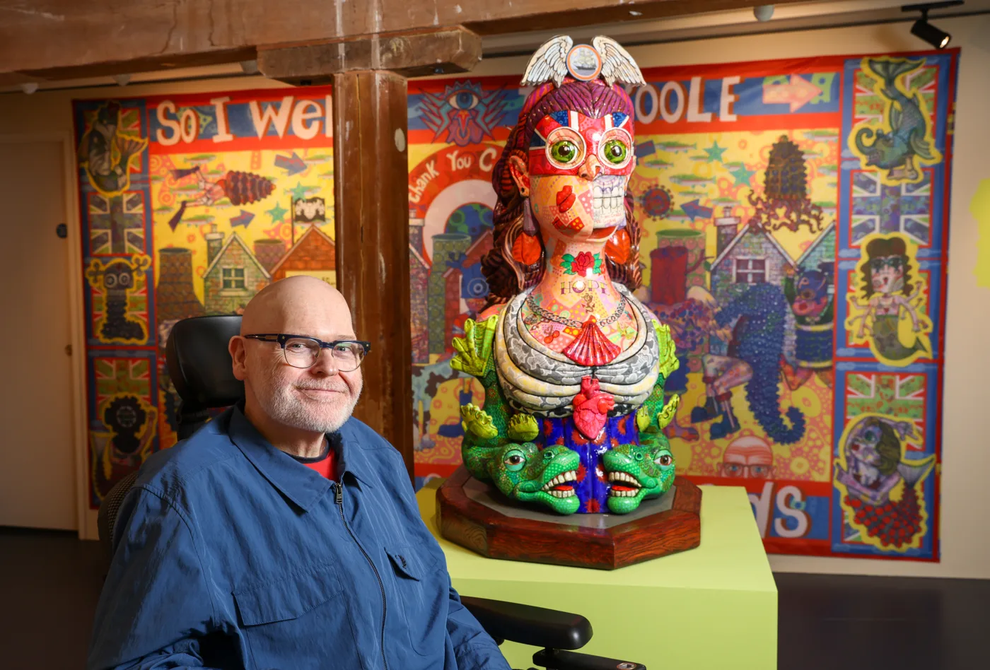 Jason Wilsher-Mills beside his masthead sculpture at Poole Museum.
