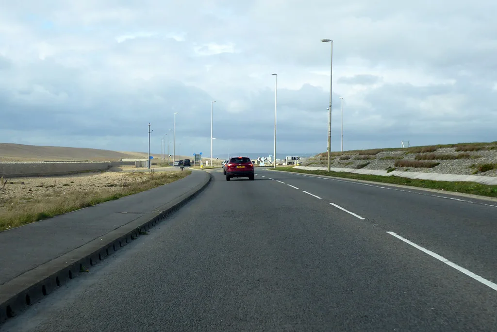 The A354 Portland Beach Road, the only road on and off Portland, with the Chesil Beach shingle bank alongside