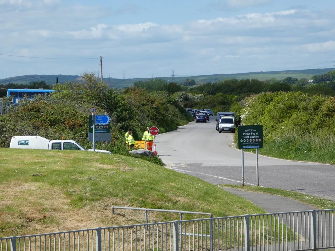 Cars queuing on the access road to Weymouth Household Recycling Centre at Lodmoor